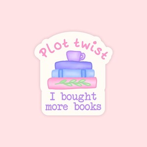 May include: A sticker on a pink background shows a stack of books in pink and blue, with a purple teacup on top. The text says "Plot twist" and "I bought more books" in pink and purple.