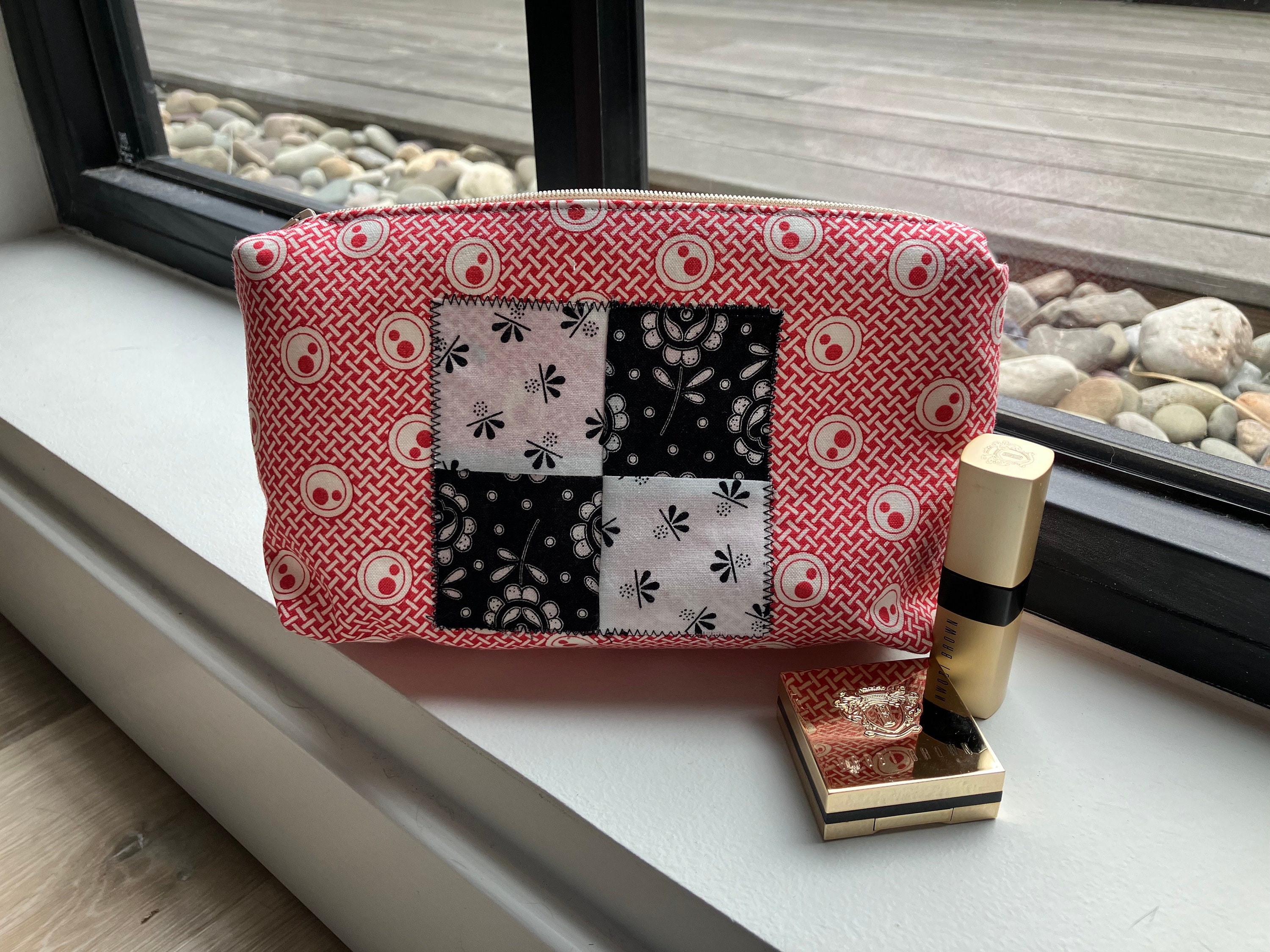 Upcycled patchwork makeup bag hidden zipper tabs attention to detail quilt shop cotton quality