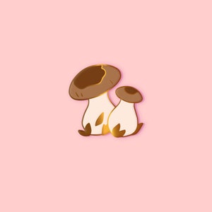May include: Two brown and white mushrooms against a light brown background.