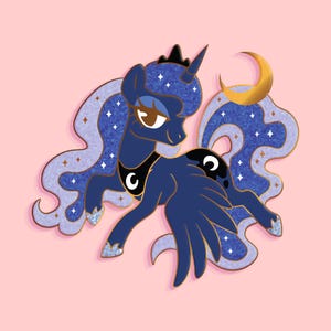 May include: A blue and gold glitter enamel pin featuring a cartoon unicorn with a crescent moon and stars. The unicorn has a purple mane and tail, and a black crown.