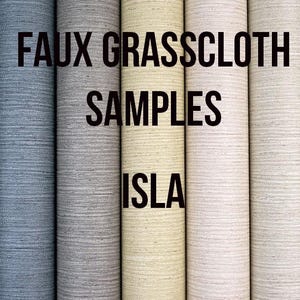 May include: A collection of rolled faux grasscloth samples in various neutral colors, including brown, blue, gray, and cream. The text "FAUX GRASSCLOTH SAMPLES ISLA" is displayed in bold black font across the image.