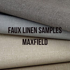 May include: Close-up of three faux linen fabric samples in shades of gray and beige. The top fabric is a dark gray, the middle is a lighter gray, and the bottom is a beige color. The text "FAUX LINEN SAMPLES" and "MAXFIELD" are printed on the image.