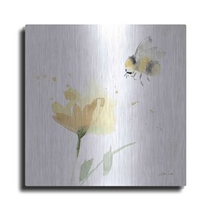 May include: A watercolor painting of a bee flying towards a yellow flower on a brushed silver background.