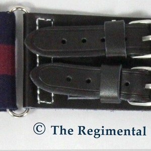 May include: A dark blue and maroon striped belt with a silver buckle and two black leather straps with silver buckles.