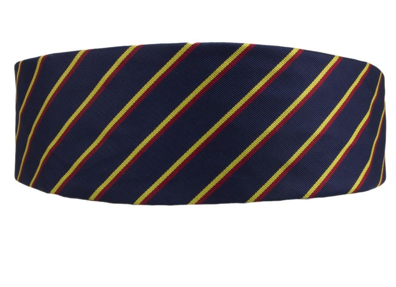 May include: A navy blue striped tie with yellow and red stripes.