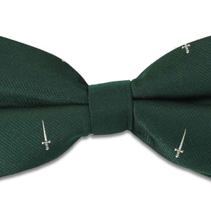 May include: A dark green bow tie with a white embroidered sword design.