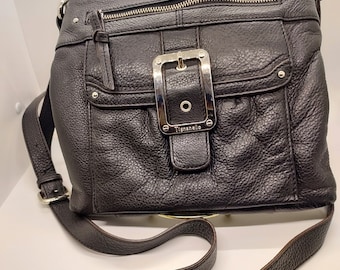 Tignanello Leather Shoulder Bag.  9 1/2"L X 9 1/2"W X 1"D.  Silver buckle.  Two zippered outside flaps.  Three zippered inside pockets.