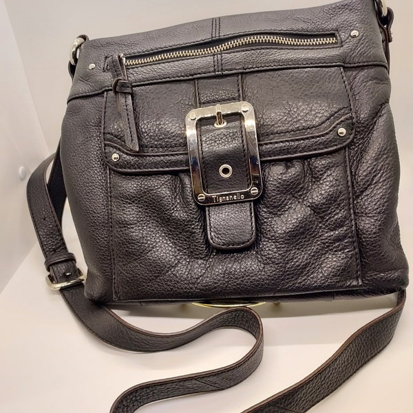 Tignanello Leather Shoulder Bag.  9 1/2"L X 9 1/2"W X 1"D.  Silver buckle.  Two zippered outside flaps.  Three zippered inside pockets.