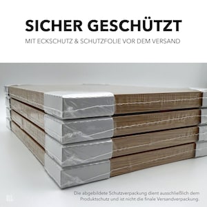May include: A stack of rectangular wooden panels, wrapped in clear plastic and protected by white corner protectors. The text "SICHER GESCH&Uuml;TZT" is displayed at the top, with additional German text below. The image shows the product packaging.