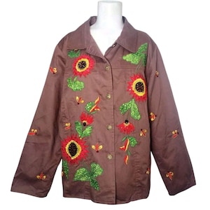 May include: A brown button-up jacket with embroidered sunflowers, leaves, and other floral details in shades of red, yellow, and green.