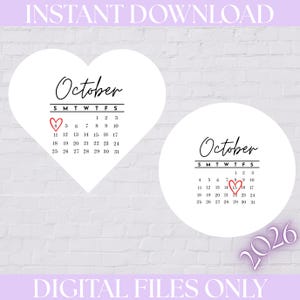 May include: Two white calendar shapes, one heart-shaped and one circular, displaying the month of October 2026. The heart-shaped calendar has a red hand-drawn heart around the 4th, while the circular calendar has a red heart around the 15th.
