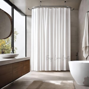 May include: A white, textured shower curtain hangs in a modern bathroom. The curtain is suspended from a curved, dark metal rod. The words "Easy Linen Crafts" are written on the curtain. A white towel hangs on the wall.