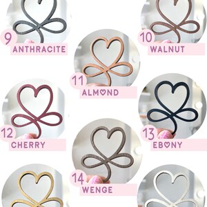 May include: A chart showing 10 different wood colors with a heart-shaped design. The colors are: Anthracite, Cherry, Oak, Almond, Wenge, Walnut, Ebony, and Natural.