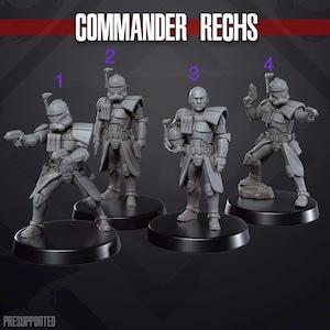 May include: Four grey miniature soldier figurines labelled COMMANDER RECHS, numbered one to four. Each figure wears tactical armour with shoulder pauldrons and utility belts. Figure three is unhelmeted, while others wear full-face helmets.