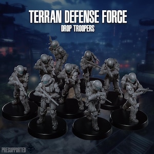 May include: A set of eight grey miniature soldier figurines titled Terran Defense Force Drop Troopers. Each figure wears tactical armour with a helmet and carries a rifle. The soldiers are posed in various combat stances on individual black circular bases.