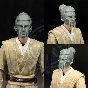 May include: A gray 3D printed head sculpt of a character with a long, braided hairstyle, a mask with a detailed design, and a beard. The head sculpt is designed for use with action figures.