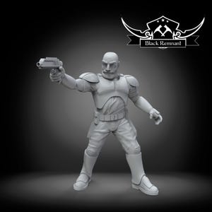 May include: A gray figurine of a bald man in a futuristic uniform, holding a gun. The figure is in a dynamic pose, as if in action. The logo "Black Remnant" is in the upper right corner.