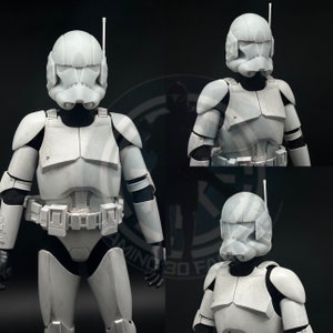 May include: Three white plastic action figures of Star Wars clone troopers. The figures are wearing white armor with black accents. The figures are posed in different stances.