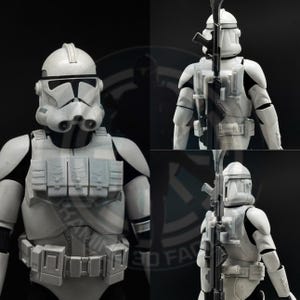 May include: A white and grey action figure of a clone trooper, a character from a science fiction franchise. The figure is wearing a helmet, armour, and a utility belt. A black rifle is attached to the figure's back.