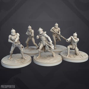 May include: A set of five unpainted off-white resin miniature figures depicting armored soldiers in various combat poses. Each figure stands on a circular base, with characters equipped with blasters, a heavy cannon, and a rocket launcher.