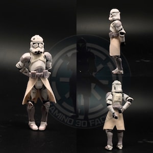 May include: Three white and gray action figures of Star Wars clone troopers. The figures are wearing white armor and have white capes. The figures are posed in different stances.