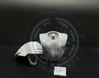 May include: A 3D printed set of grey plastic armor pieces for a figure. The set includes a chest piece, a helmet, and a set of rectangular pieces.