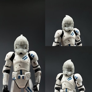 May include: Three white plastic action figures of Star Wars clone troopers. Each figure has a different helmet design. The figures are wearing white armour with blue accents. The figures are posed in a standing position.