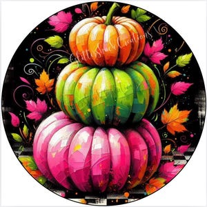 May include: A vibrant, circular design featuring a stack of three pumpkins in shades of orange, green, and pink. The pumpkins are surrounded by colorful leaves and decorative swirls against a black background. The text "GlitterShack Creations" is visible.