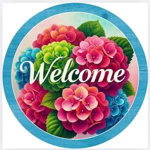 May include: A round wooden sign with a blue border and a watercolor background featuring a bouquet of colorful hydrangeas. The sign says "Welcome" in white cursive lettering.