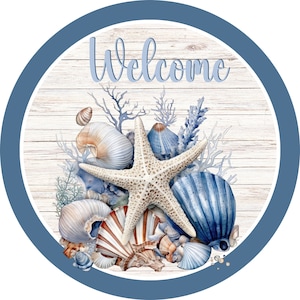 May include: A round wooden sign with a blue border and the word "Welcome" in white script. The sign features a starfish and various seashells in shades of blue, white, and brown.