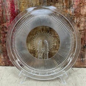 Vintage Glass Cake Plate: Ribbed Starburst Pattern, Three-Toed Footed Design