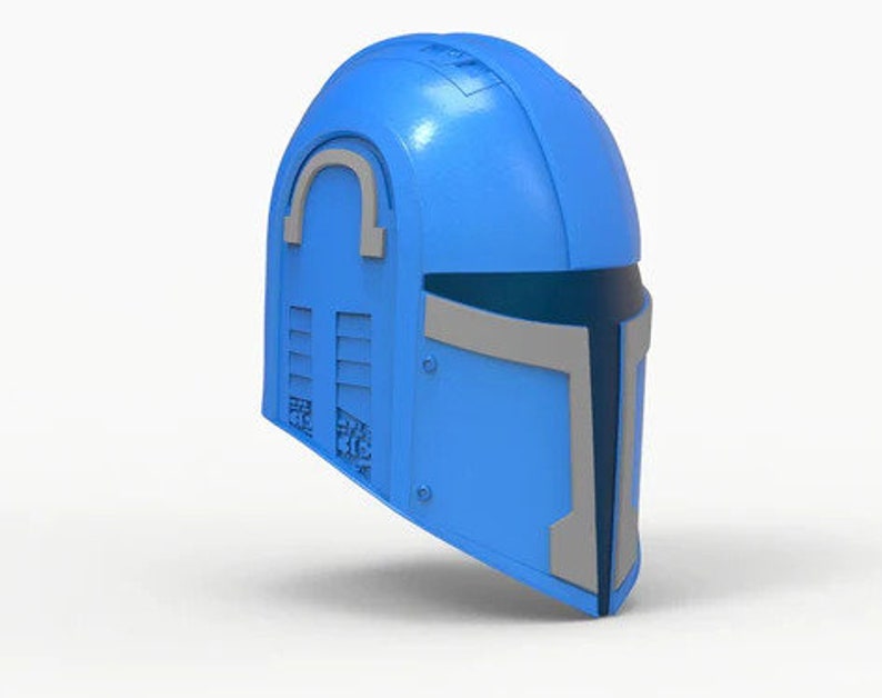 May include: A blue helmet with a gray visor and a silver accent on the top. The helmet has a textured surface and a design on the side.
