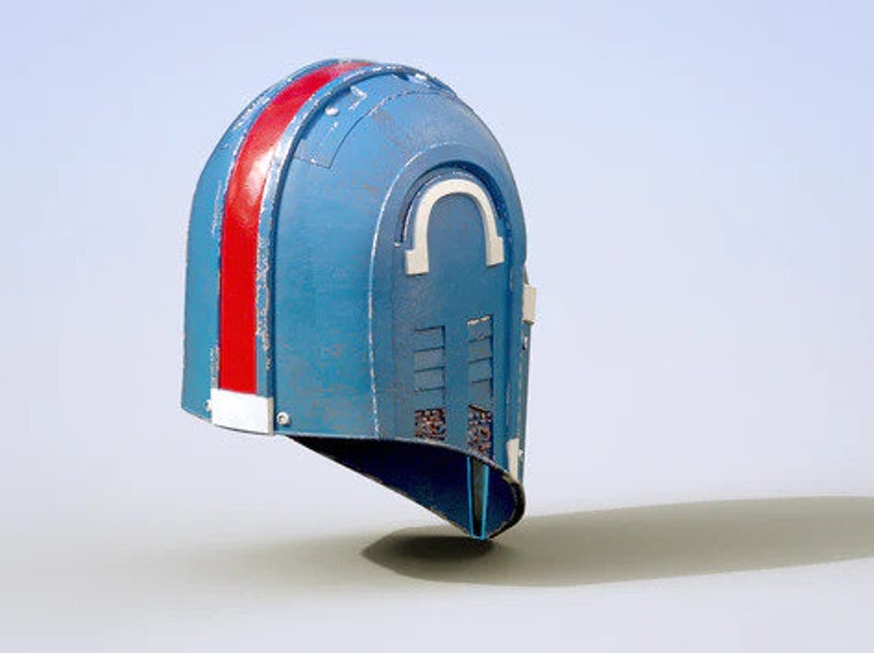 May include: A blue and red helmet with a white stripe and a series of small vents. The helmet has a rounded top and a pointed chin.