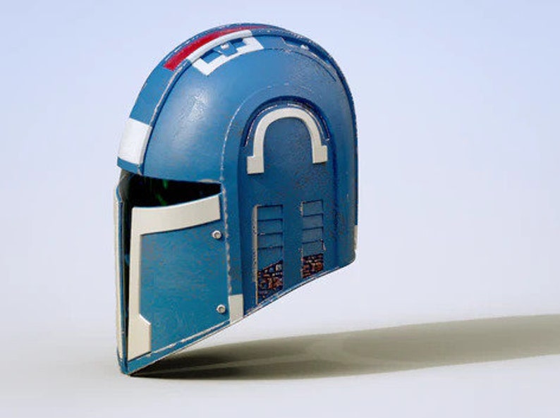 May include: A blue and white helmet with a visor and a series of rectangular vents on the side. The helmet has a white stripe with red accents on the top.