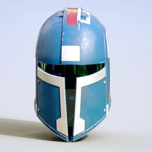 May include: A blue and white helmet with a red and white stripe on the top. The helmet has a visor and a faceplate.