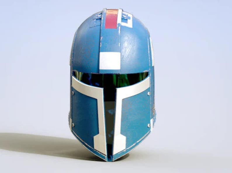 May include: A blue and white helmet with a red and white stripe on the top. The helmet has a visor and a faceplate.