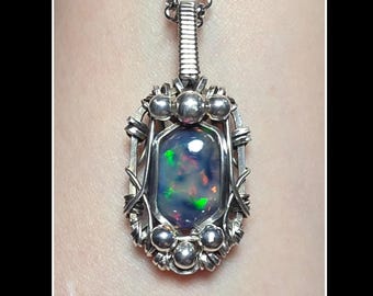 Unisex 9.25 carat Ethiopian opal pendant in solid sterling silver