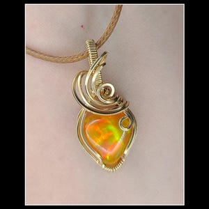 6.25 carat natural Ethiopian opal pendant in 14k gold filled wire.