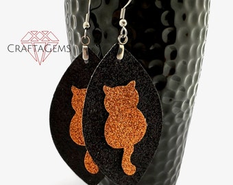 Glittery Orange Cat Faux Leather Earrings on Glitter Black Marquise Shape