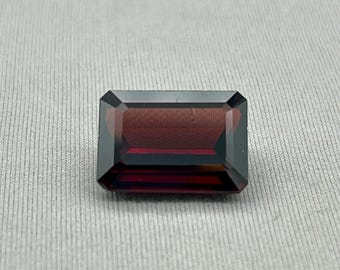 Natural Garnet. 10.24 Carat, Faceted Emerald Cut Gemstone.