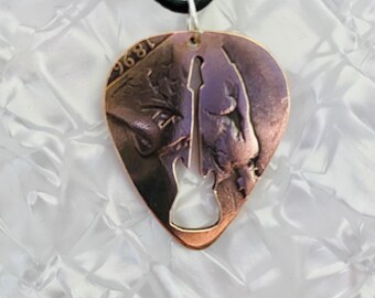 Plectrum, Keychain,  pendant with guitar silhouette cut into it, made from a vintage British penny