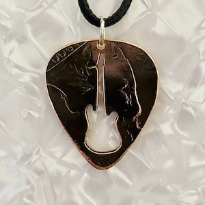 Plectrum, Keychain,  pendant with guitar silhouette cut into it, made from a vintage British penny
