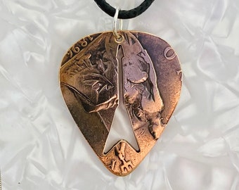 Plectrum, Keychain,  pendant with guitar silhouette cut into it, made from a vintage British penny