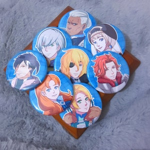 May include: A set of nine round button pins featuring anime-style illustrations of characters with different hairstyles and clothing. The buttons are on a blue and white checkered background.
