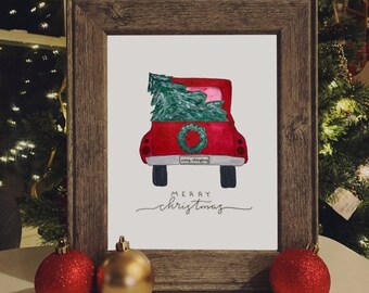 May include: A framed watercolor painting of a red pickup truck with a Christmas tree in the back. The truck has a wreath on the back and a license plate that says "Merry Christmas". The painting is on a white background and has the words "Merry Christmas" written below the truck.