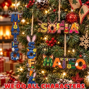 May include: Four custom wooden hanging ornaments featuring the names MATEO, SOFIA, SOFA, and MATEO. Each ornament incorporates colorful letter designs with thematic icons like police badges, carrots, rabbit ears, sunglasses, and ties, all suspended by twine.