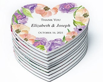 May include: Stack of heart-shaped thank you cards with a watercolor floral design in shades of purple, pink, and green. The text reads "Thank You Elizabeth & Joseph October 16, 2021".