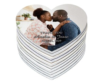 May include: Heart-shaped wedding favor with a photo of a couple kissing. The image is layered over a striped pattern. Text reads "THANK YOU Amelia & Jesse JULY 21, 2029."