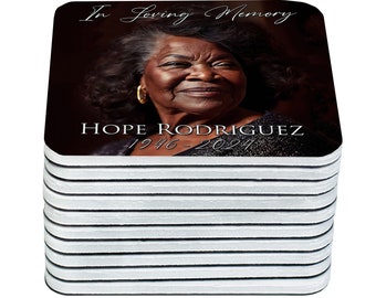 May include: A stack of 12 square coasters with a photo of a woman and the text "In Loving Memory HOPE RODRIGUEZ 1946-2024".