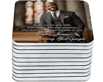 May include: A stack of square coasters featuring a smiling man in a suit, with text that reads "Thank you for your faith, your prayers, and your presence. Our church is stronger because of you. Pastor James 10 years serving God's people."